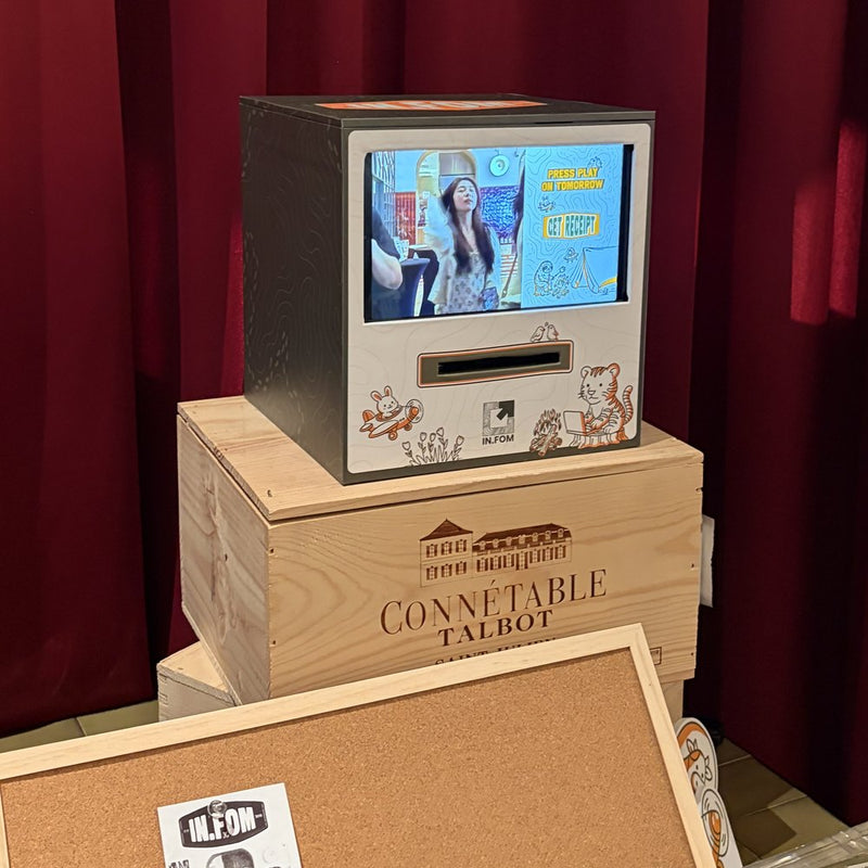 Receipt Booth with an illustrated front on a wooden crate