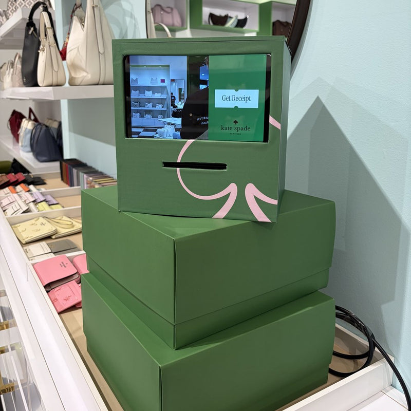 Green Receipt Booth on stacked green boxes